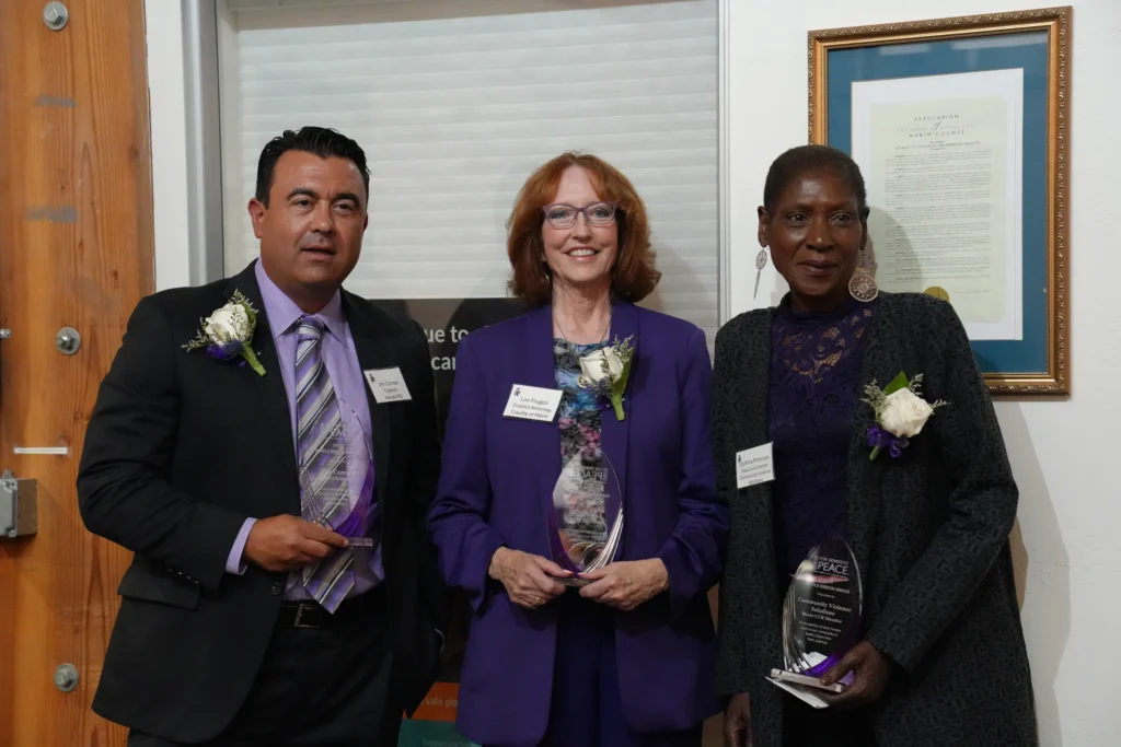 Three C4DP honorees stand together holding their Purple Ribbon Awards, including one presented to Community Violence Solutions for their work as a Marin CCR member in building a future free from violence.